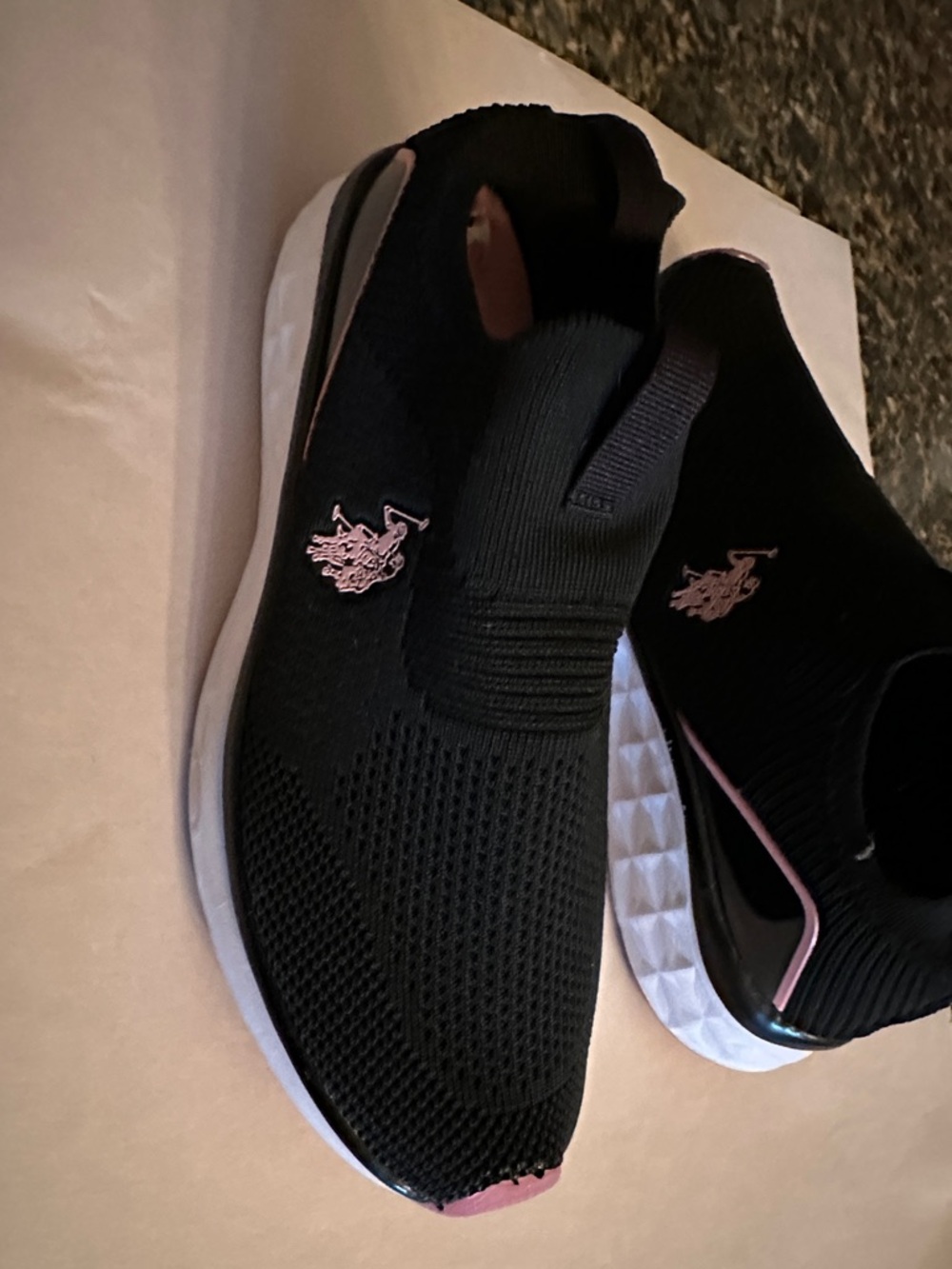 U.S. Polo Assn. Women’s Black Knit Slip-On Sneakers with Pink Logo